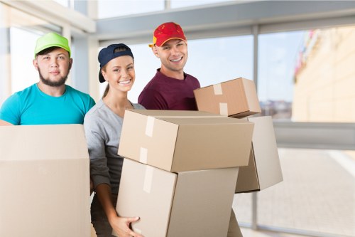 Professional movers handling furniture during a Charlton house move