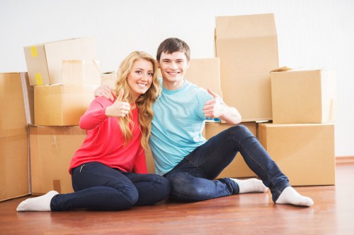 Professional movers loading furniture during a local move